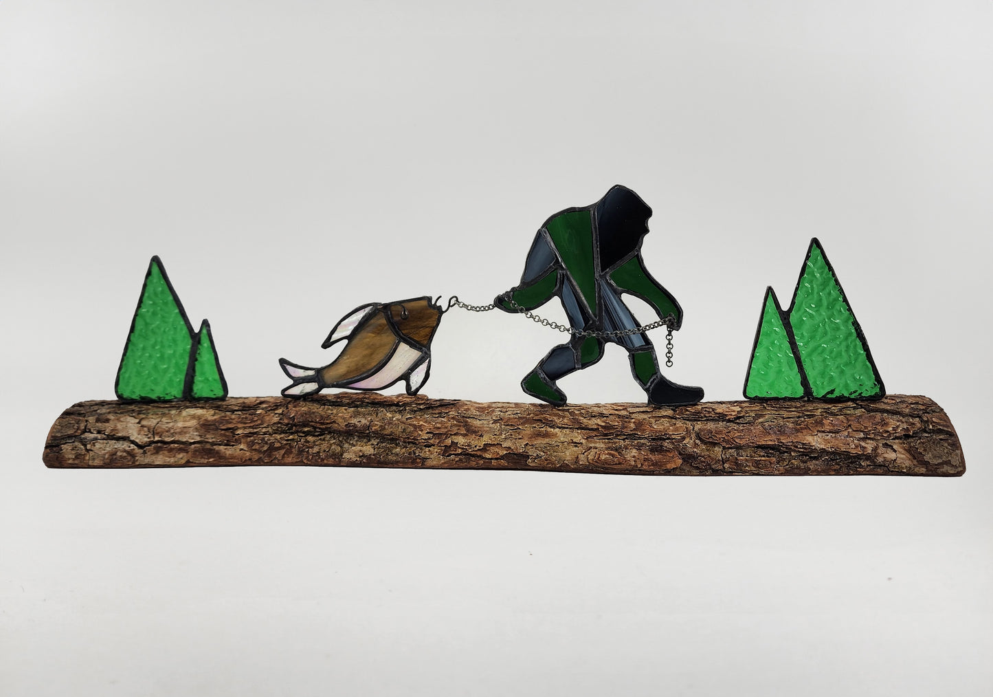 Bigfoot Dragging Fish on Log Stained Glass